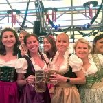 A group of women serving beer