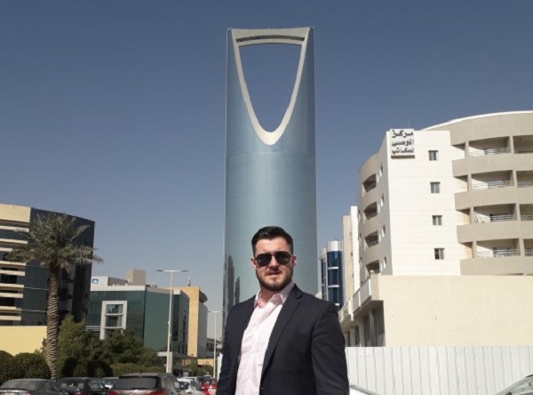 Man outside modern building